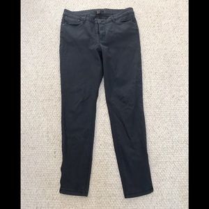 Navy blue skinny jeans with zippers on sides.